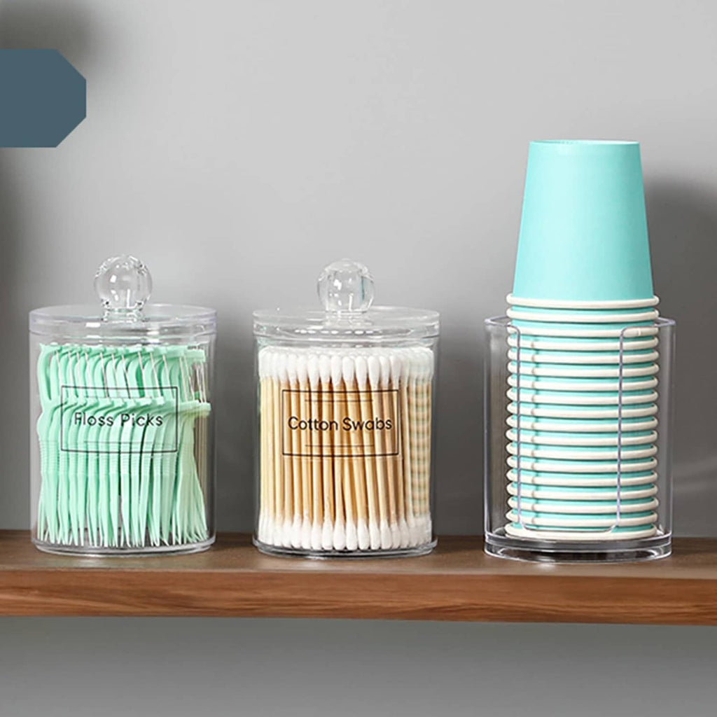 Three clear acrylic canister dispensers with dome lids and mint, white, and light blue bands