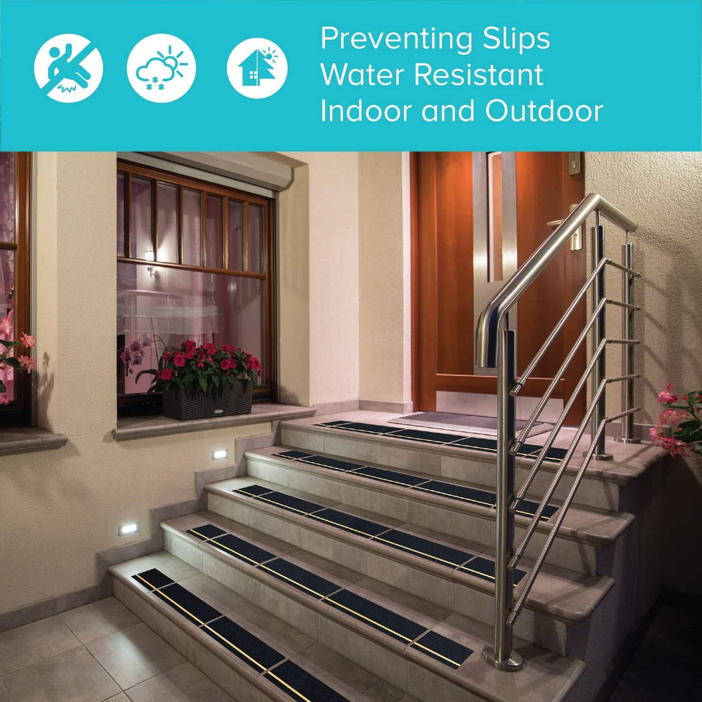 Anti-slip traction tape applied to stair steps, black with yellow reflective stripes