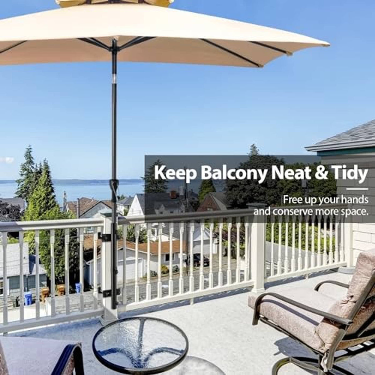Black umbrella holder attached to railing post with clamp bracket and pole sleeve