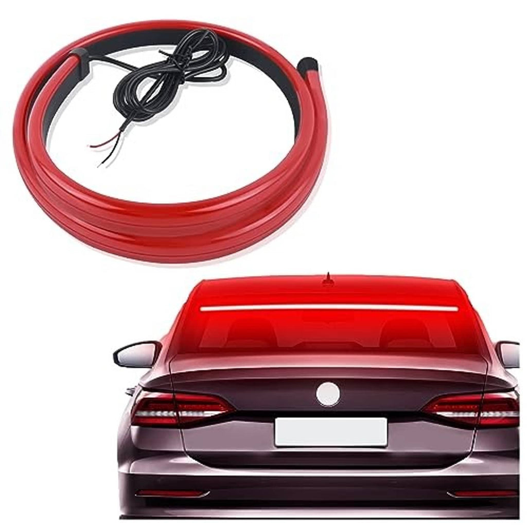 Flexible red LED third brake light strip installed on car rear, glowing red center bar