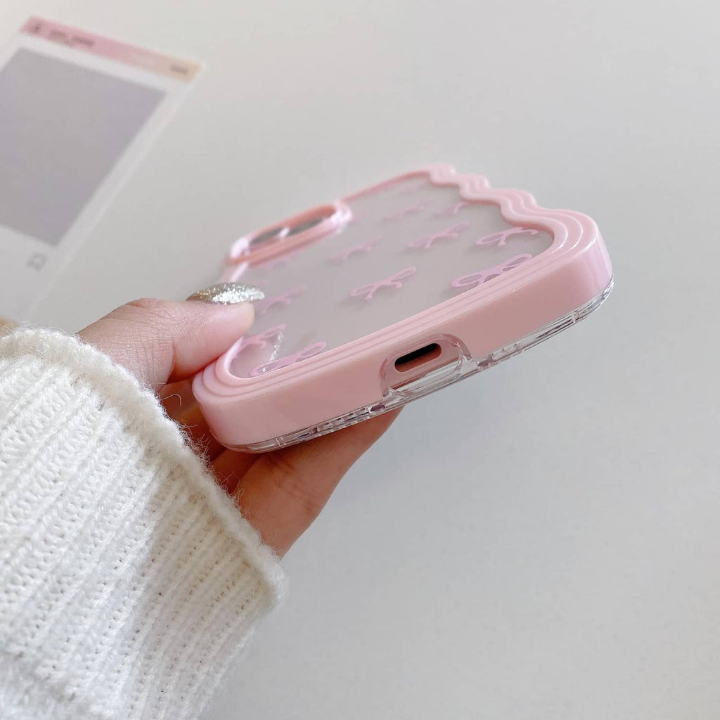 Pink clear iPhone case with bow pattern and charging port opening on the bottom edge.