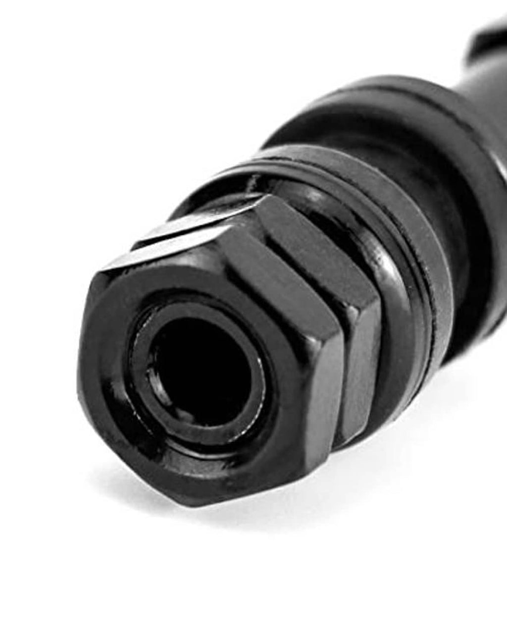 Close-up of black clamp-in valve stem end with inner opening and hex body