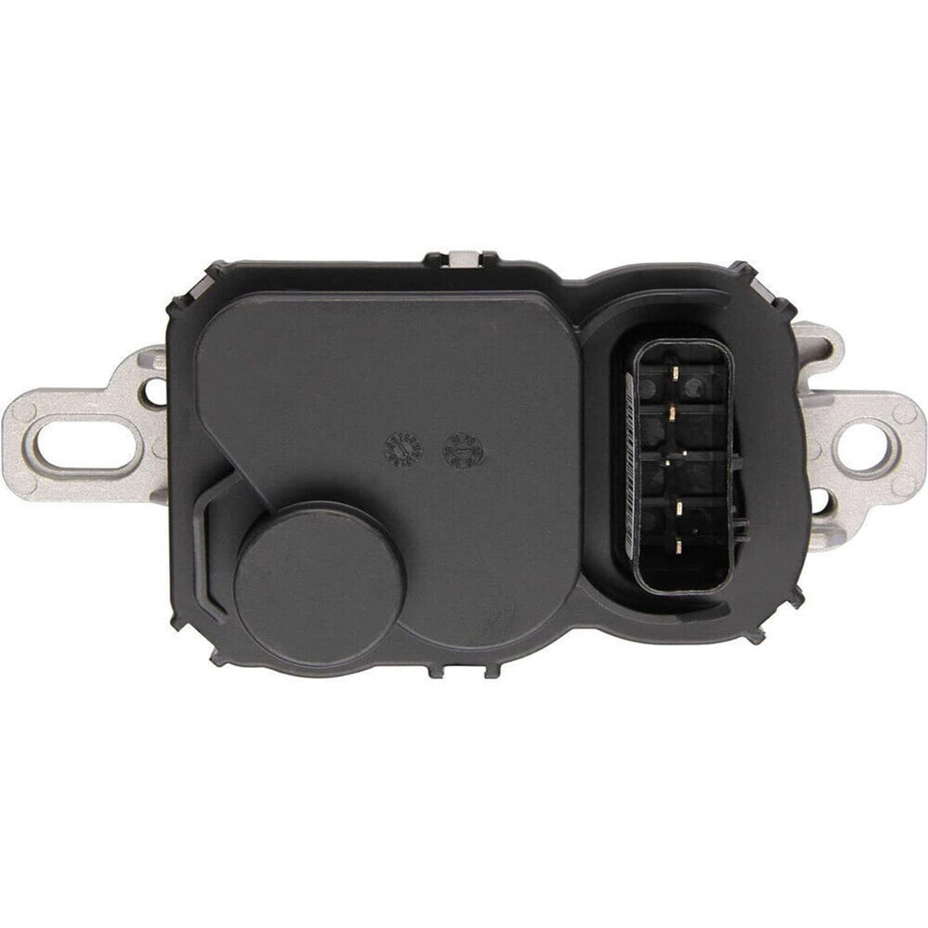 Fuel pump driver module showing black button cover and open electrical connector, silver base.
