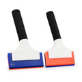 Double-edge blade rubber squeegee, white blade with black textured handle and blue base.
