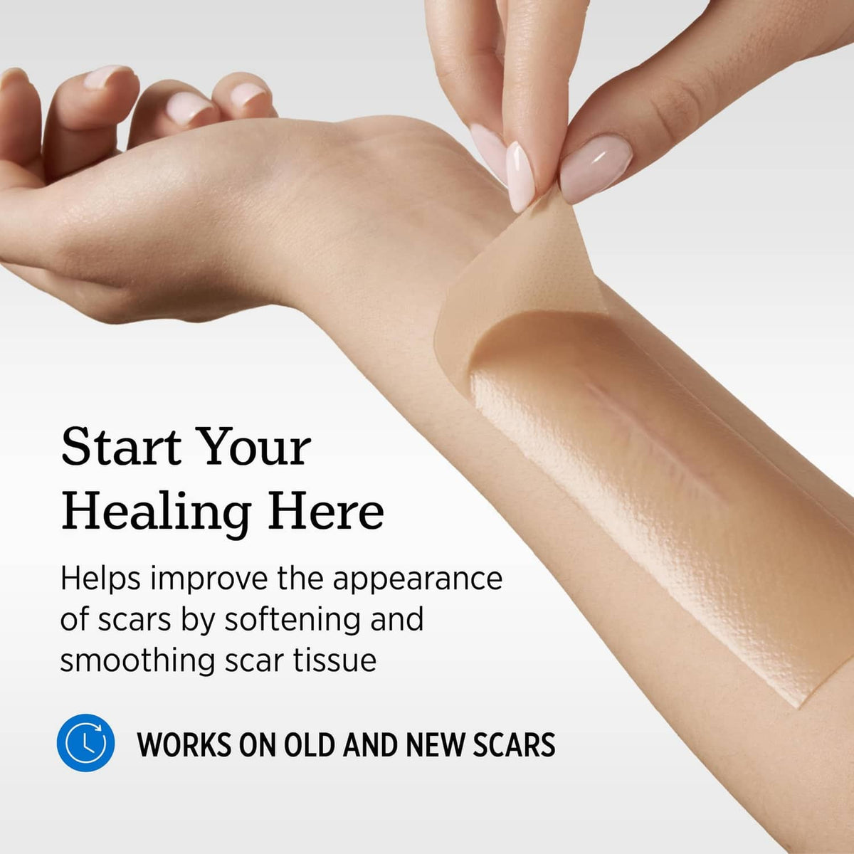 Light beige silicone scar sheet applied to skin with tabs for easy placement