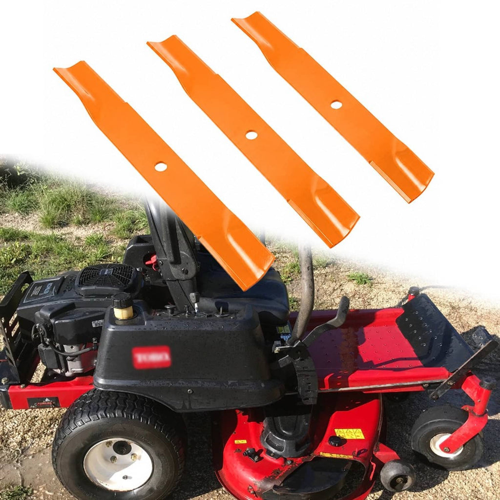 Orange mower blades installed on a lawn mower deck, three-blade set