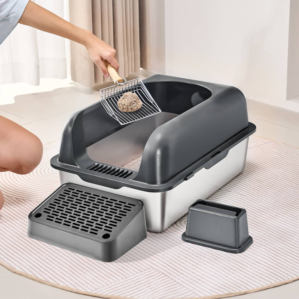 Covered cat litter box with lid open, litter scoop over tray, plus base pan