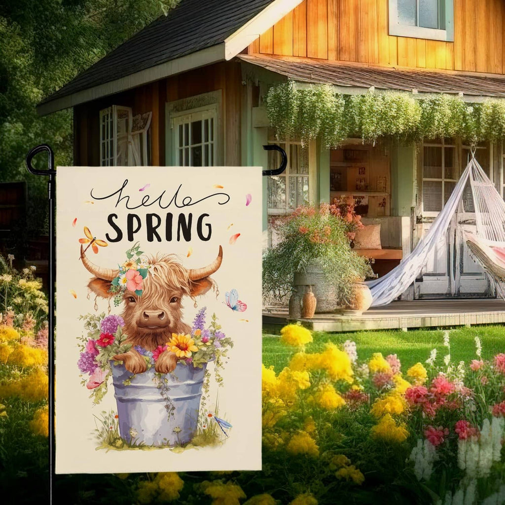 Hello Spring cream garden flag featuring a highland cow with flowers in a pot