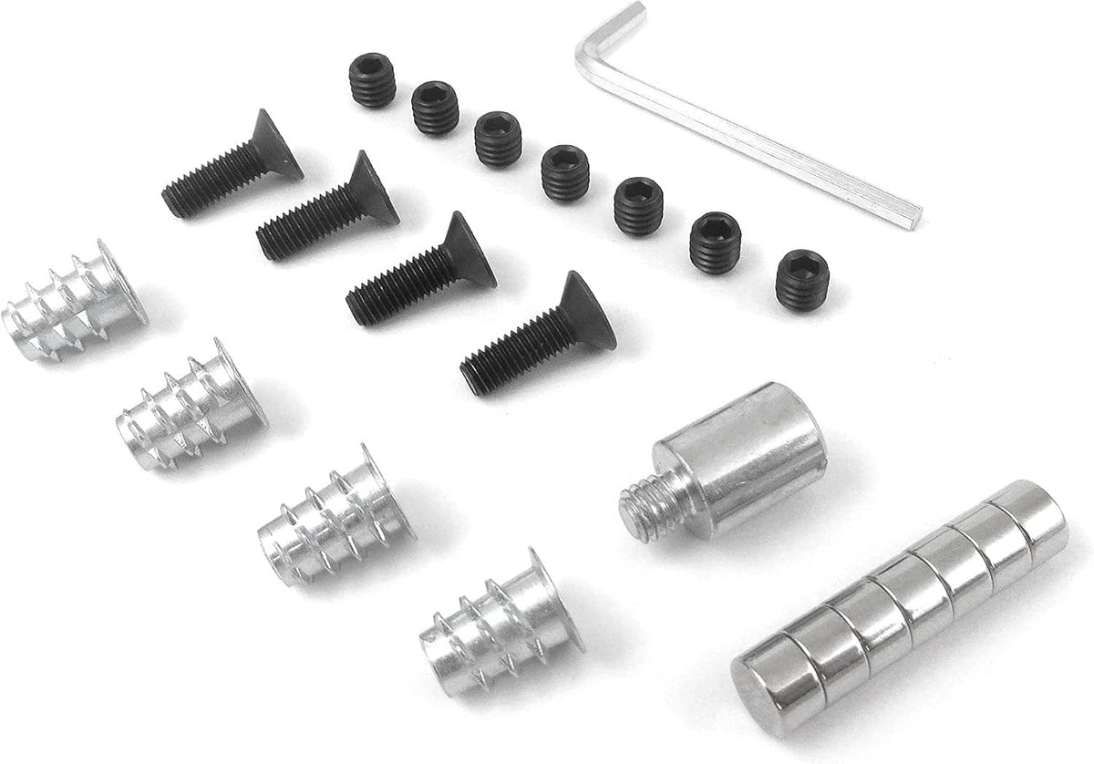 Router table insert mounting hardware assortment: screws, threaded inserts, and steel spacers.