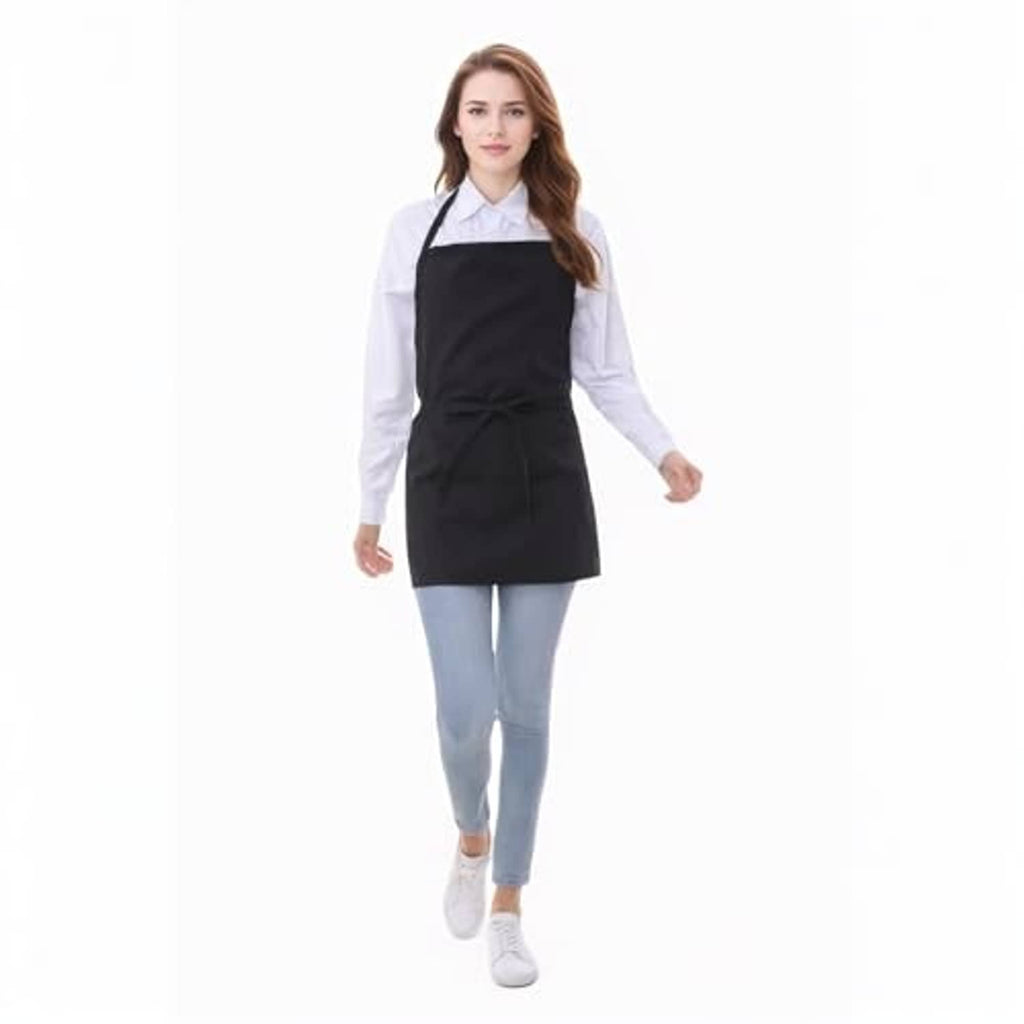 Black cotton short apron with 3 pockets and a tied waist, front view on model.