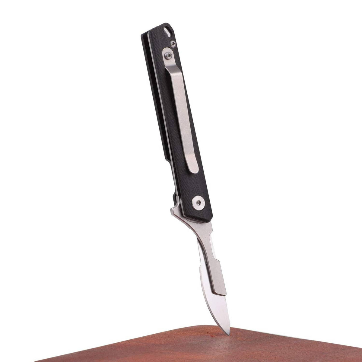 Folding pocket knife with black handle and silver blade, standing upright