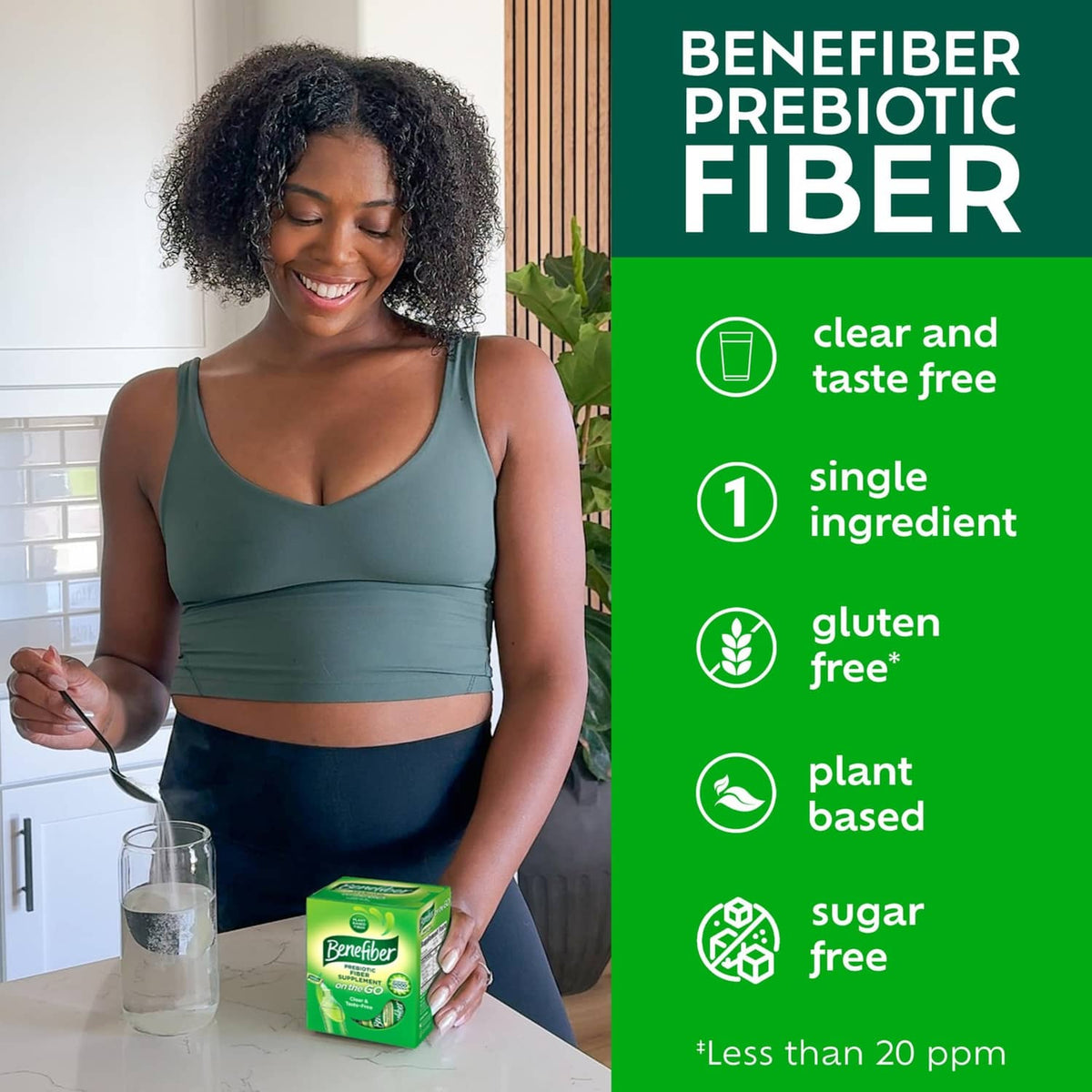 Prebiotic fiber supplement box on counter beside woman pouring powder into a glass