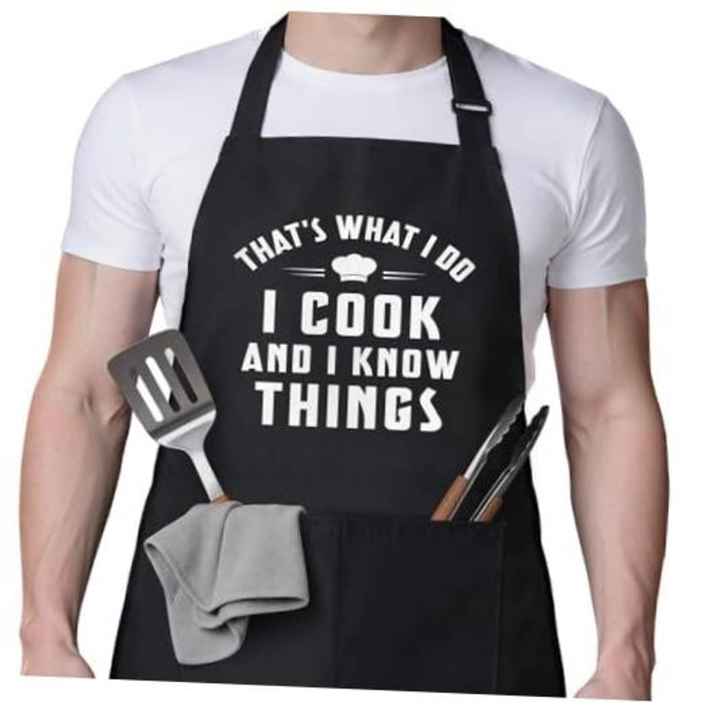 Black cooking apron with front pocket and “I cook and I know things” text graphic