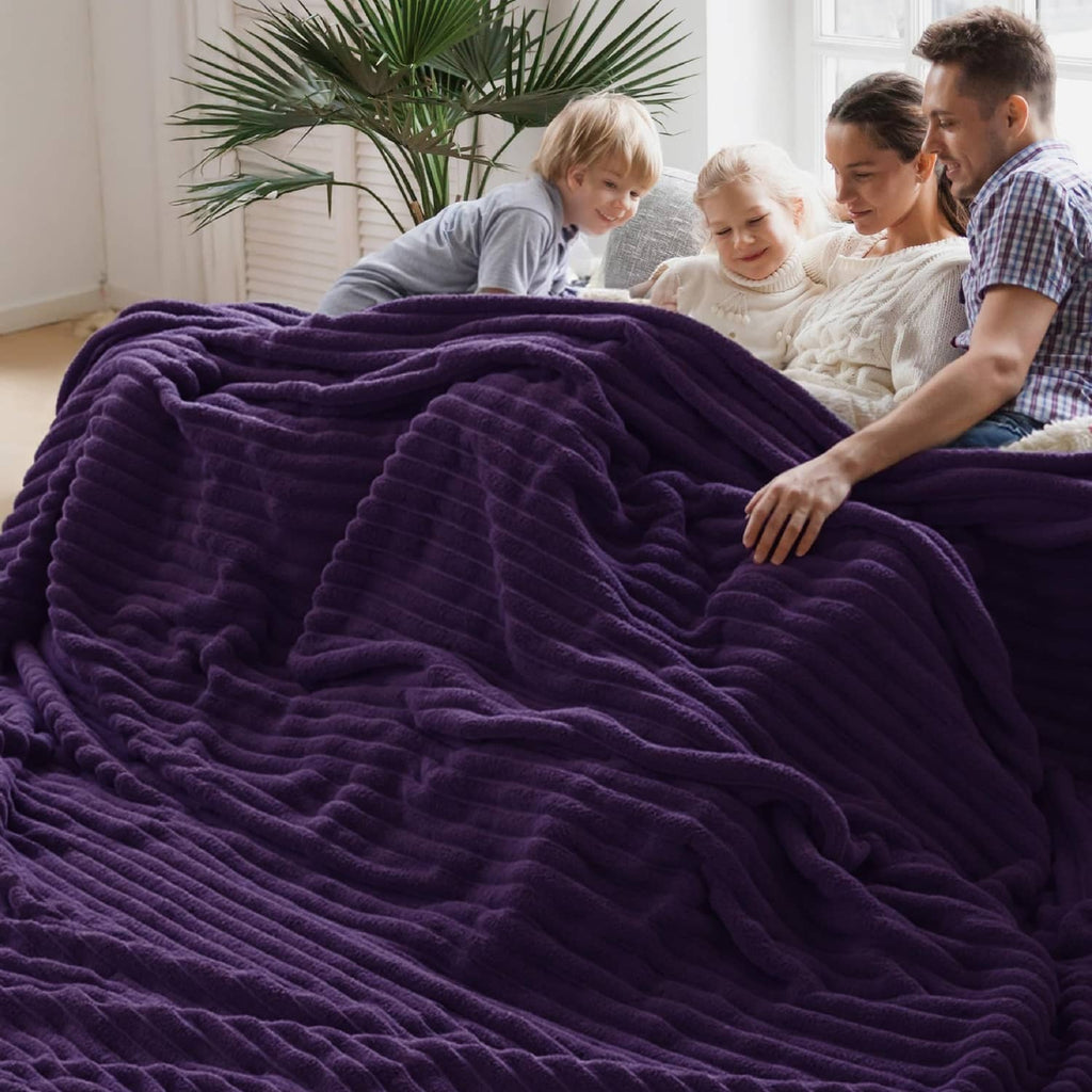 Purple fleece blanket pulled up with thick ridged texture in soft folds