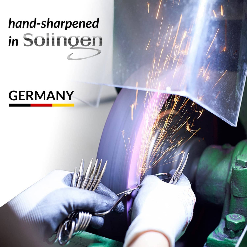 Sparked sharpening scene with a metal cutting blade, hand-sharpened Solingen tools