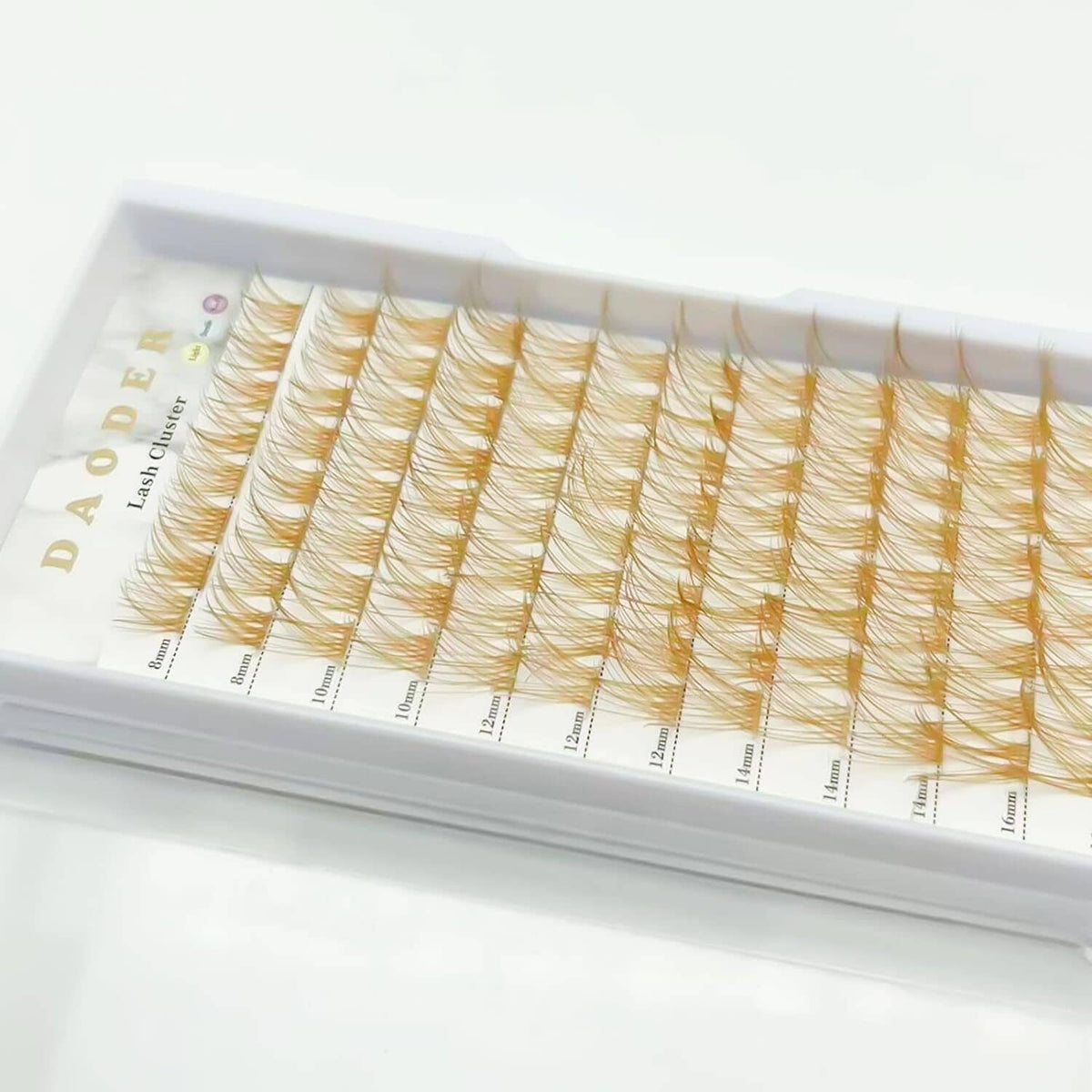 Brown false lash cluster tray with D-curl lashes in mixed lengths