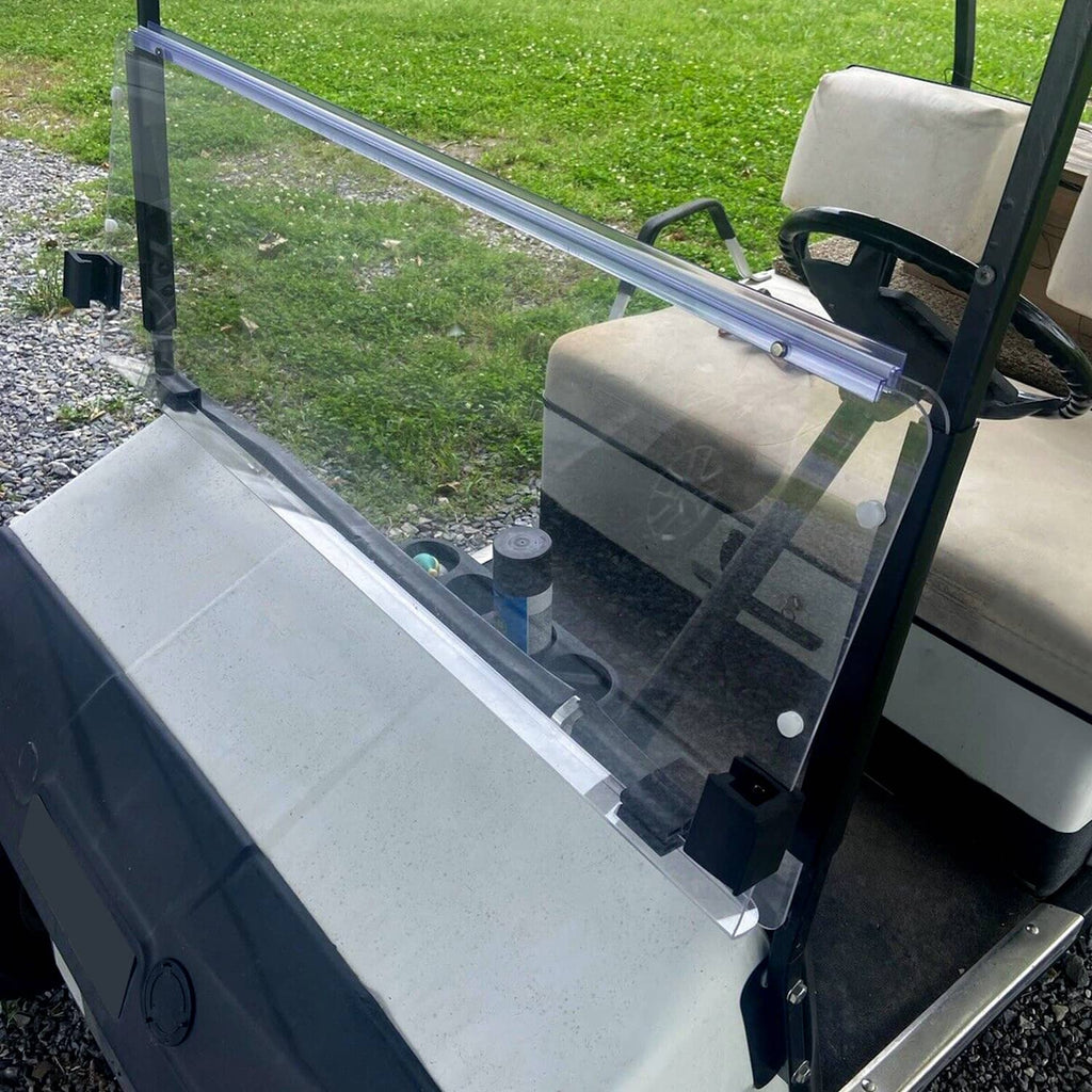 Side view of installed clear windshield with blue bar and black mounting blocks