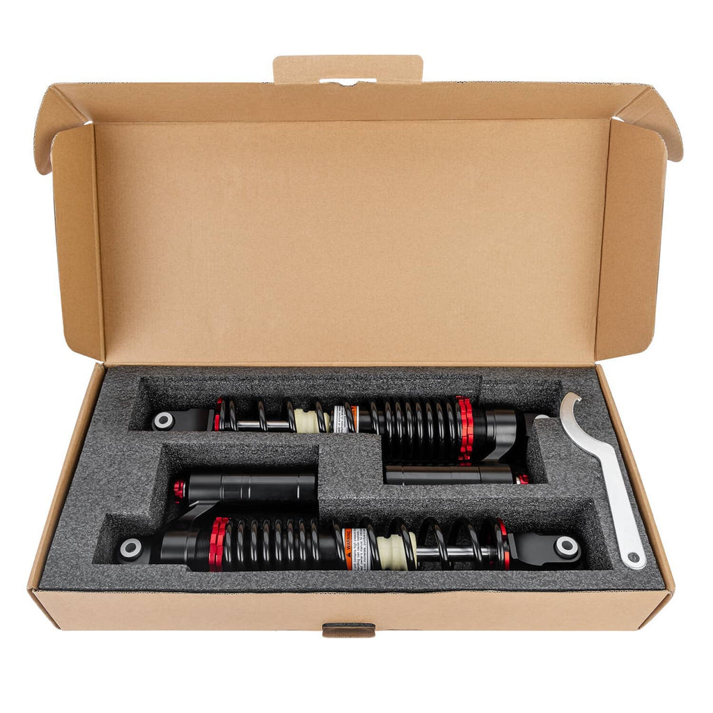Front air shock absorbers set packed in cardboard box with foam insert and tools