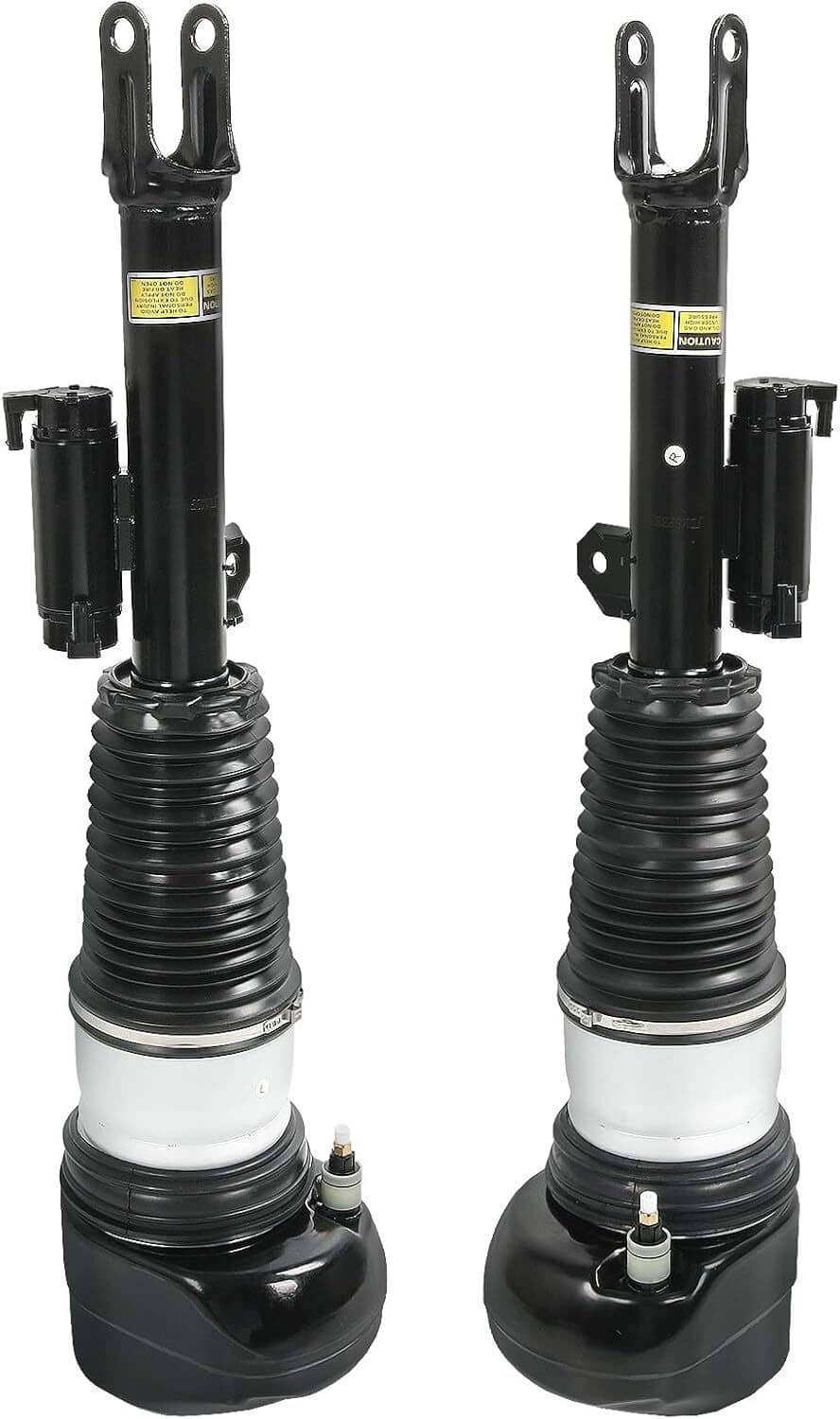 Front air suspension shock strut pair standing upright with black springs and white bases