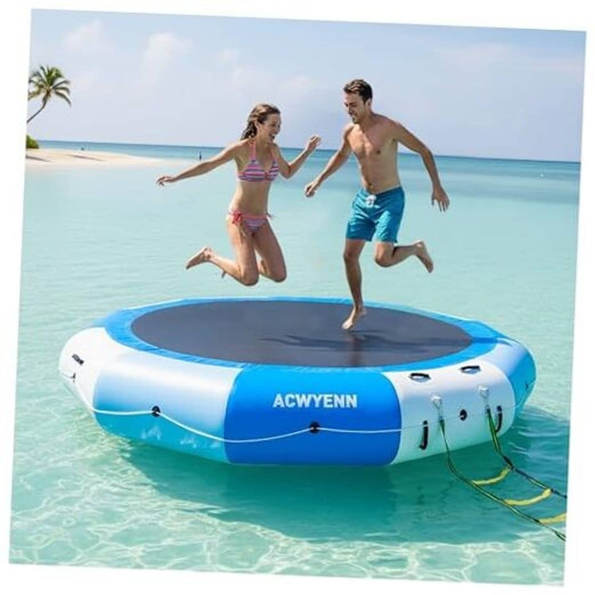 Blue and white inflatable floating water trampoline with a black round jumping mat.