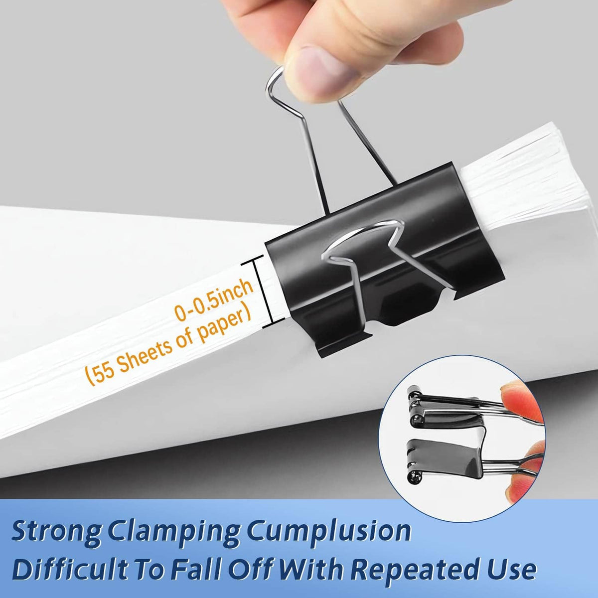 Hand placing a black binder clip on white papers, silver spring handle visible