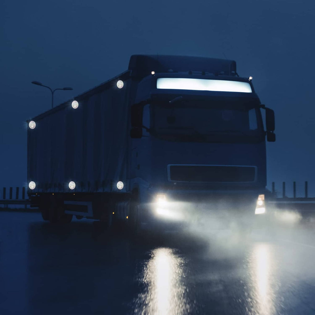 Front round reflective marker lights on a truck for improved visibility at night