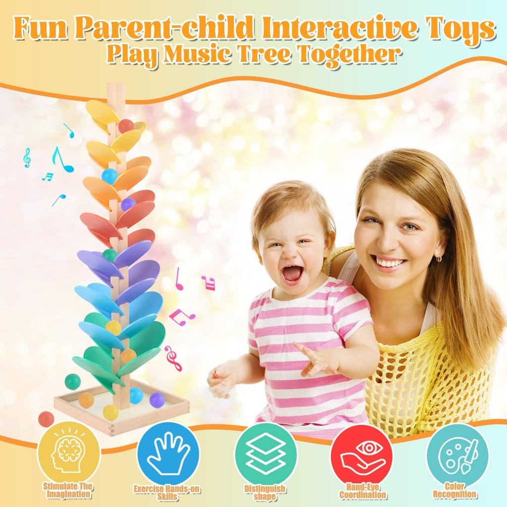 Wooden marble run music tree toy with rainbow leaves and colorful balls, child playing