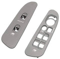 Grey driver-side window switch panel with door lock buttons and control icons