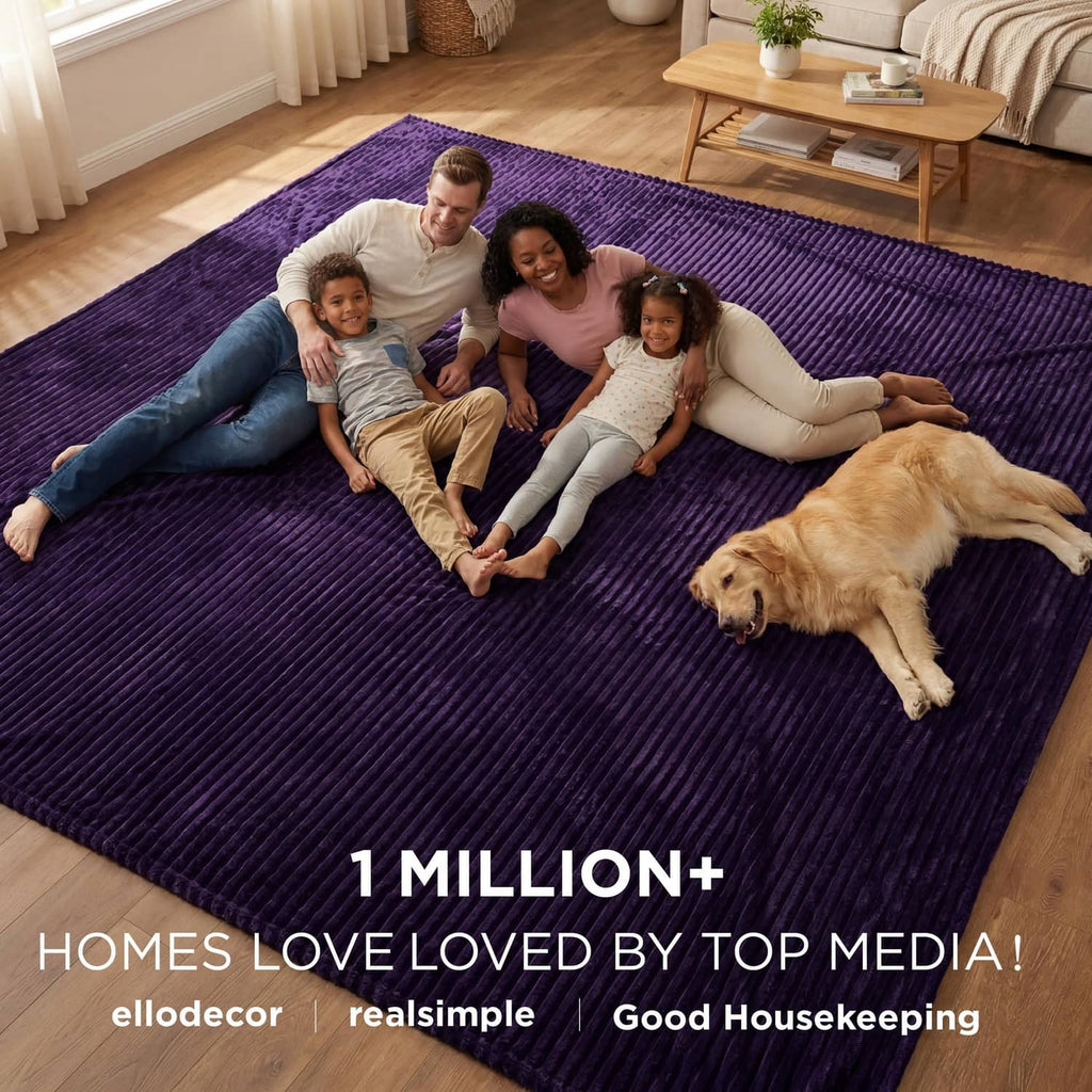 Purple fleece blanket spread flat on floor with plush ridged weave