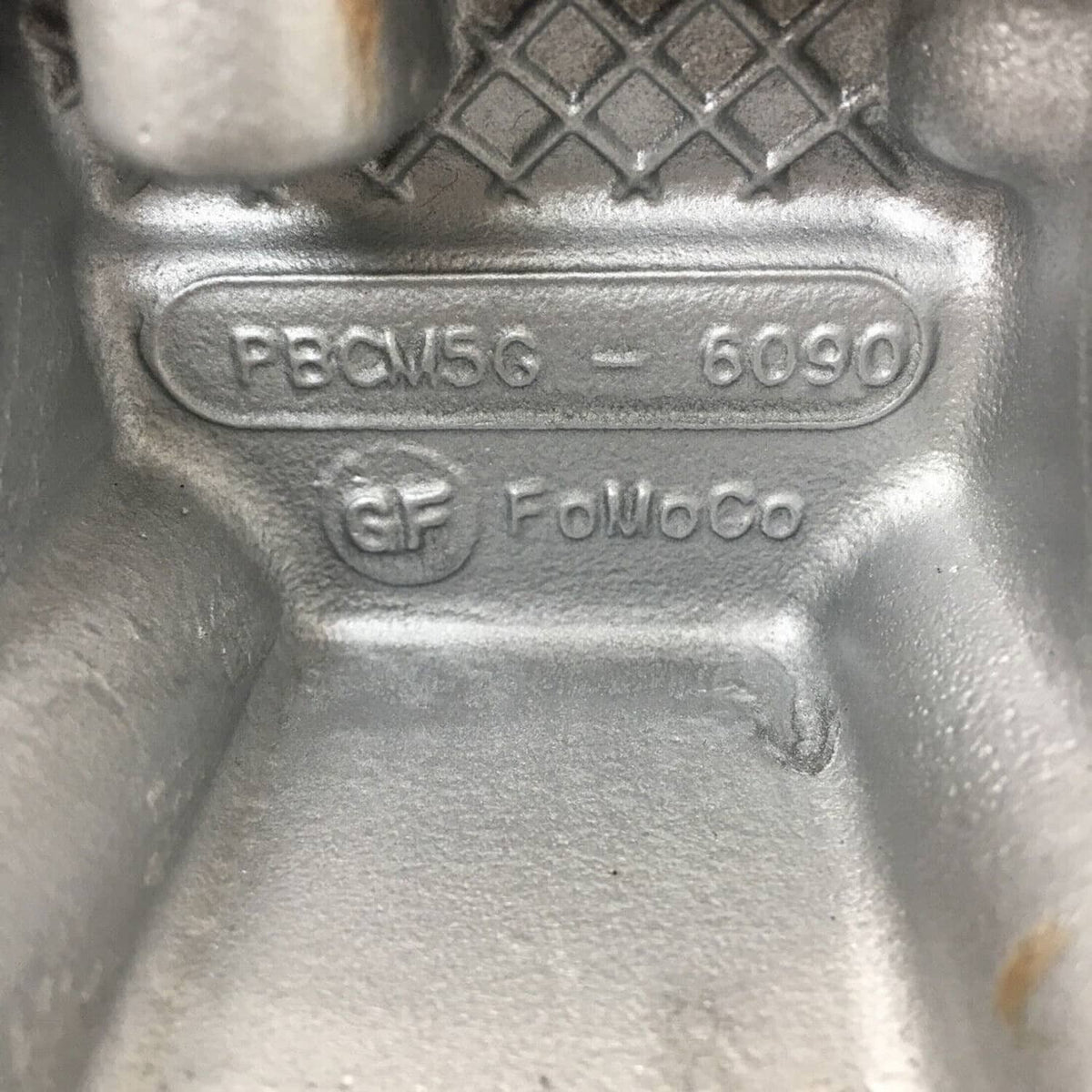 Cylinder head casting marking CM5G-6090 with Ford logo