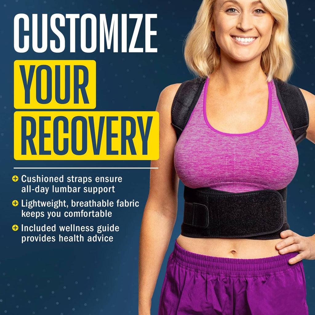 Black posture corrector back brace on a woman, padded panel over a pink sports top.