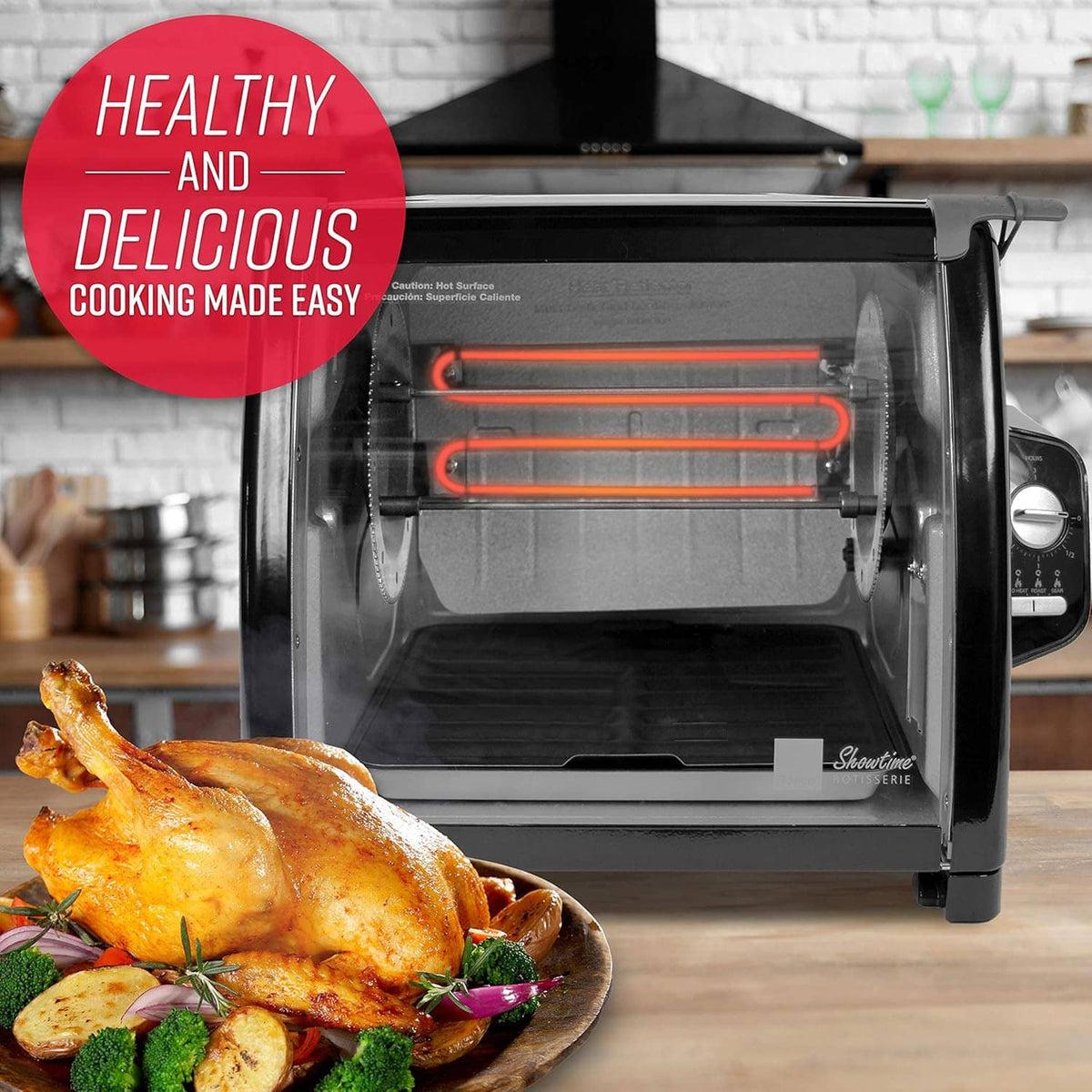 Open countertop rotisserie oven with exposed heating elements and roasted chicken on tray
