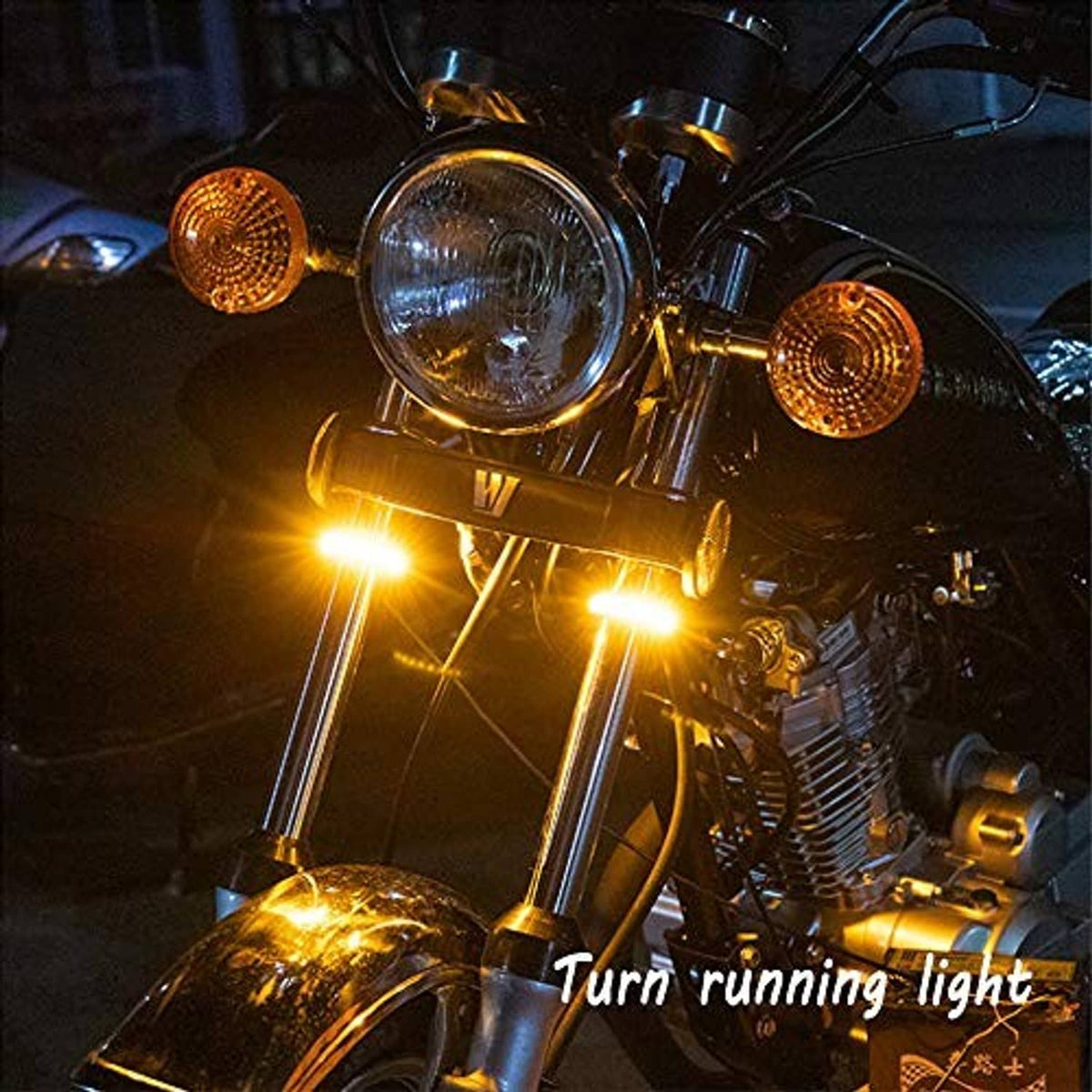 Motorcycle front lighting with amber running/turn glow from LED fork signal lights