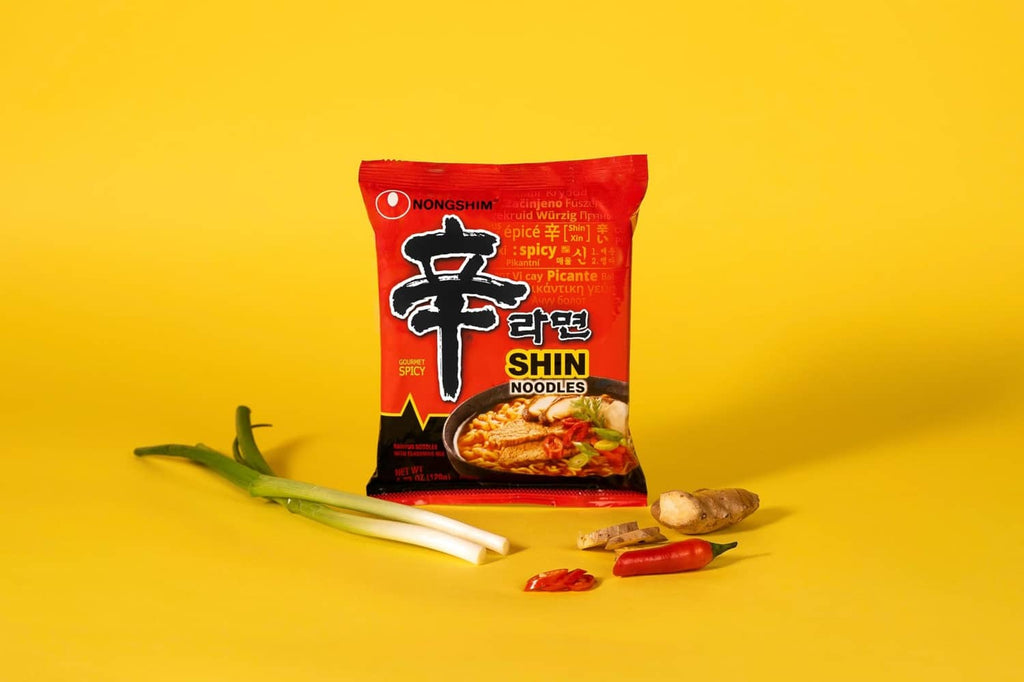 Spicy ramen noodle single pack with red Nongshim Shin Ramyun packet and chili