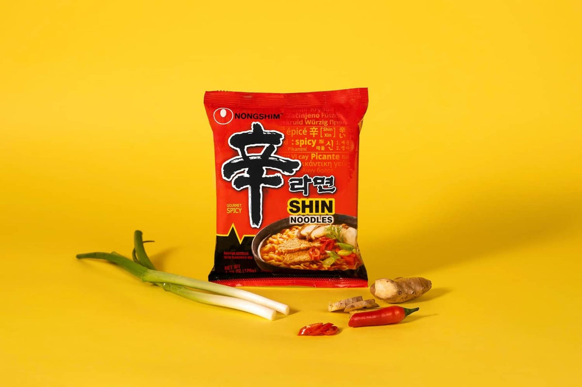 Spicy ramen noodle single pack with red Nongshim Shin Ramyun packet and chili