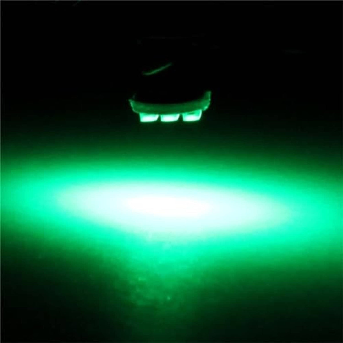 Green LED light glow with wide green beam and visible bulb hotspot