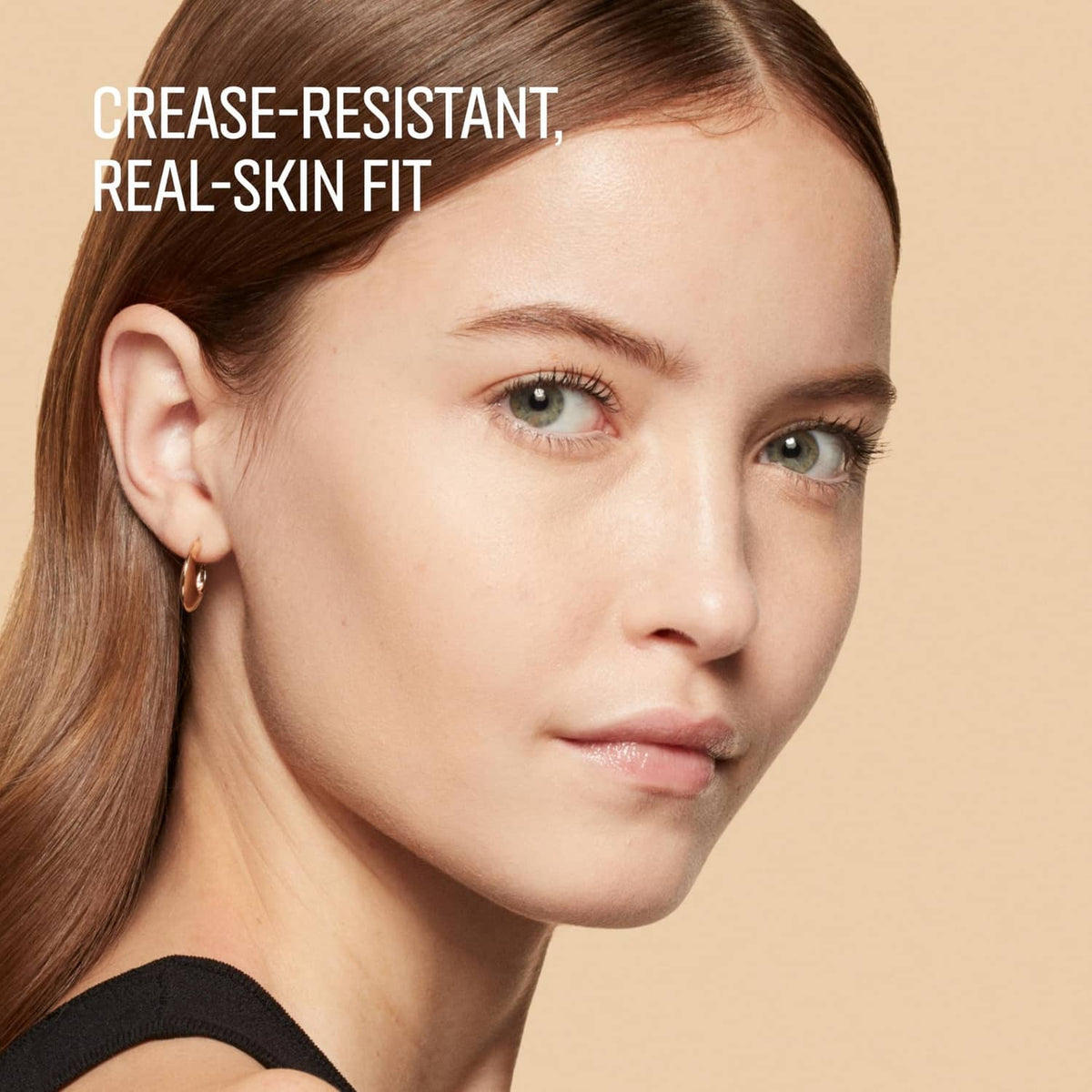 Sand concealer on face, highlighting under-eye area around eye