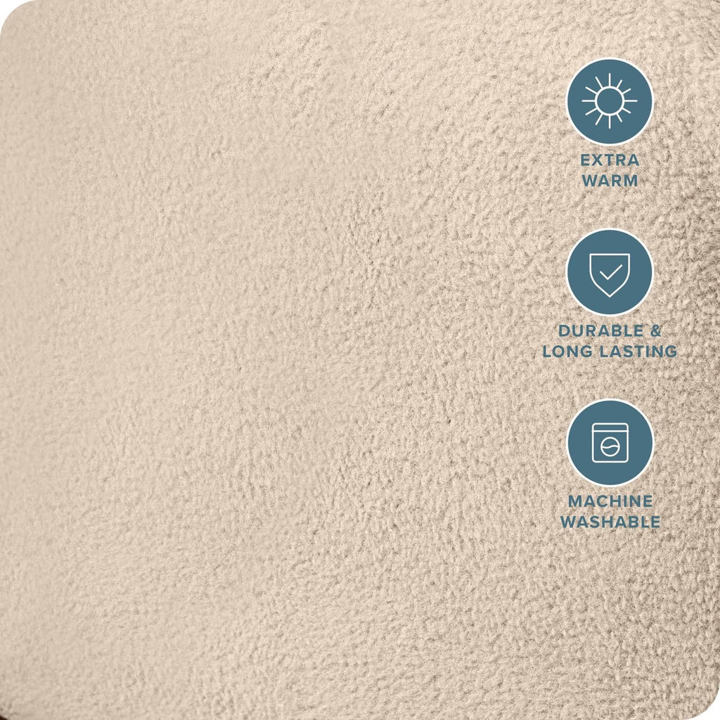 Beige plush fleece fabric of a fitted bottom sheet with dense, soft textured surface.