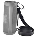 Gray silicone speaker case with shoulder strap and carabiner clip for portable Bluetooth speaker