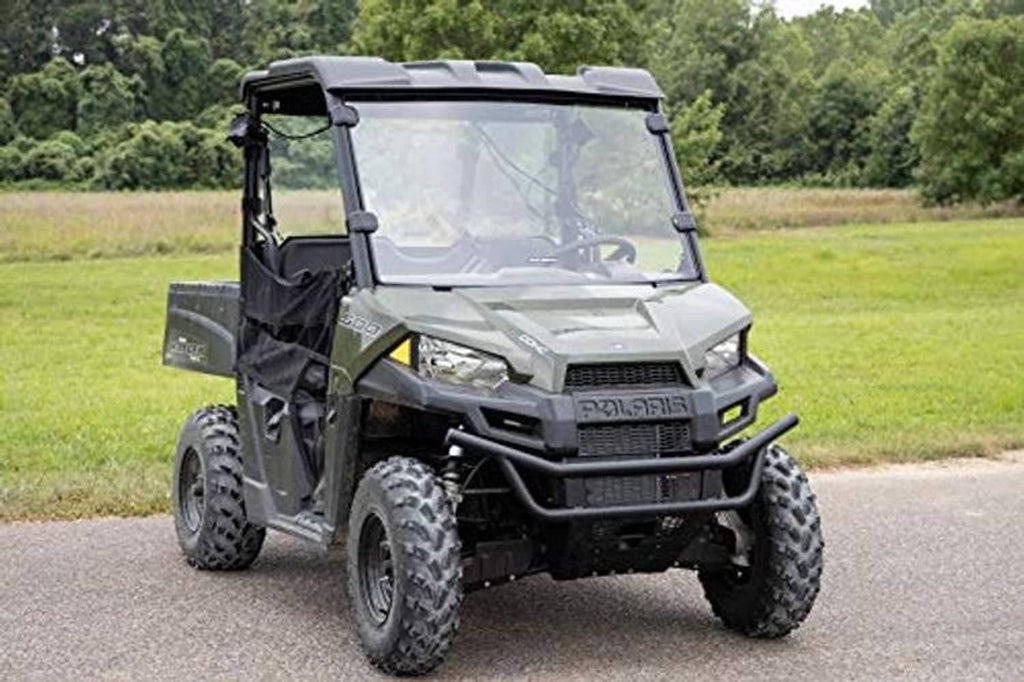 Side view of full windshield with black frame on a utility side-by-side