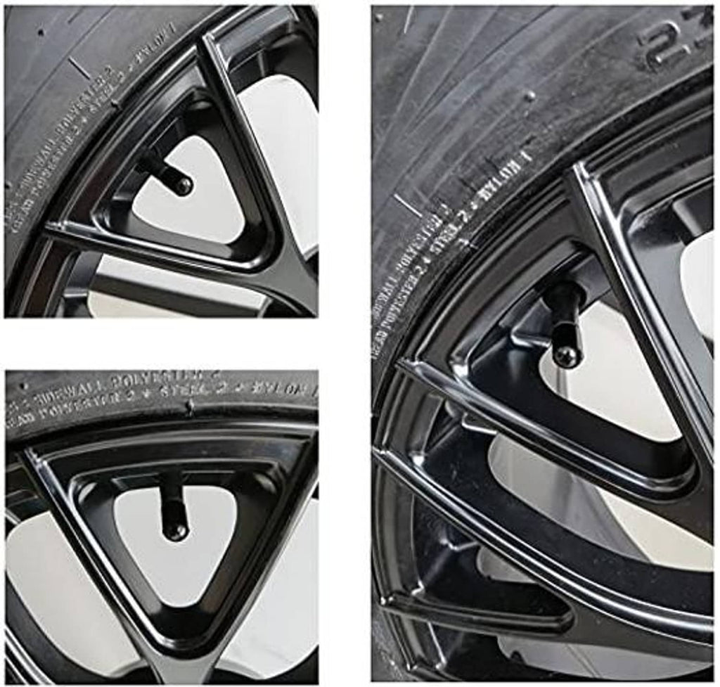 Black tire valve stem cap on wheel valve, close-up view