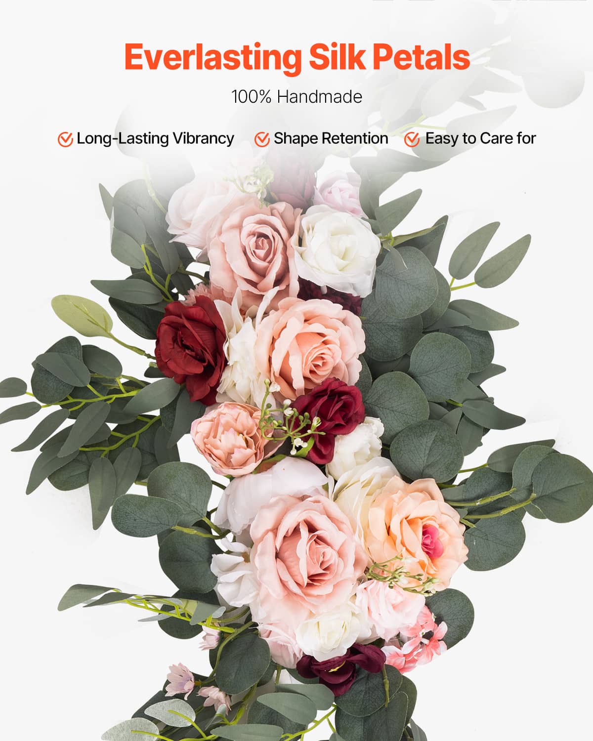 Artificial flower bouquet with pink and cream roses and lush green eucalyptus-style leaves