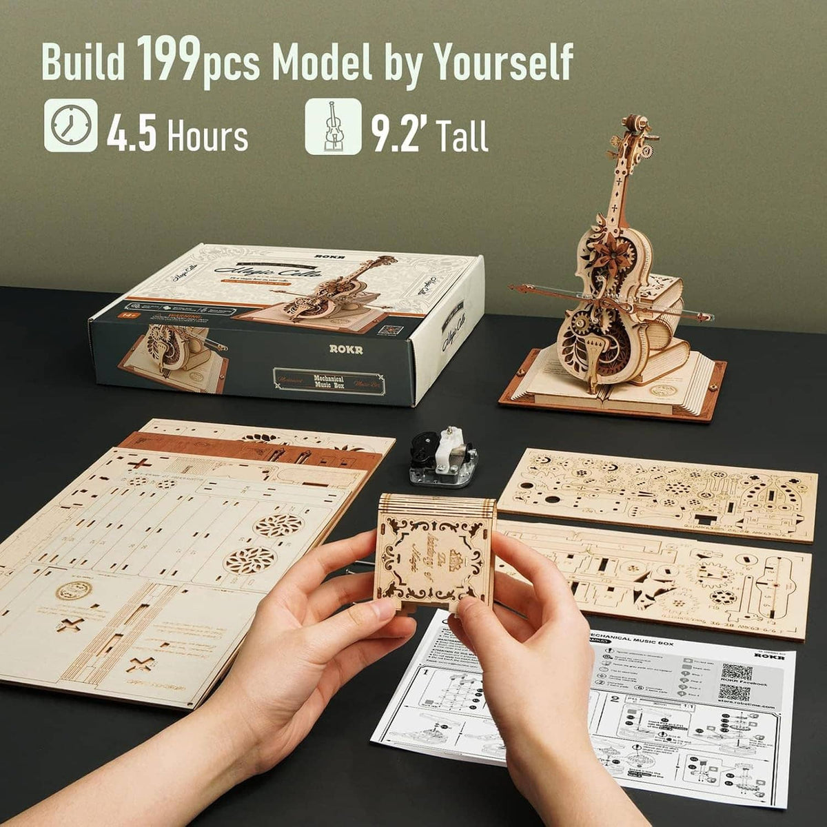 Wooden 3D cello model kit with base, instruction sheets, and build pieces