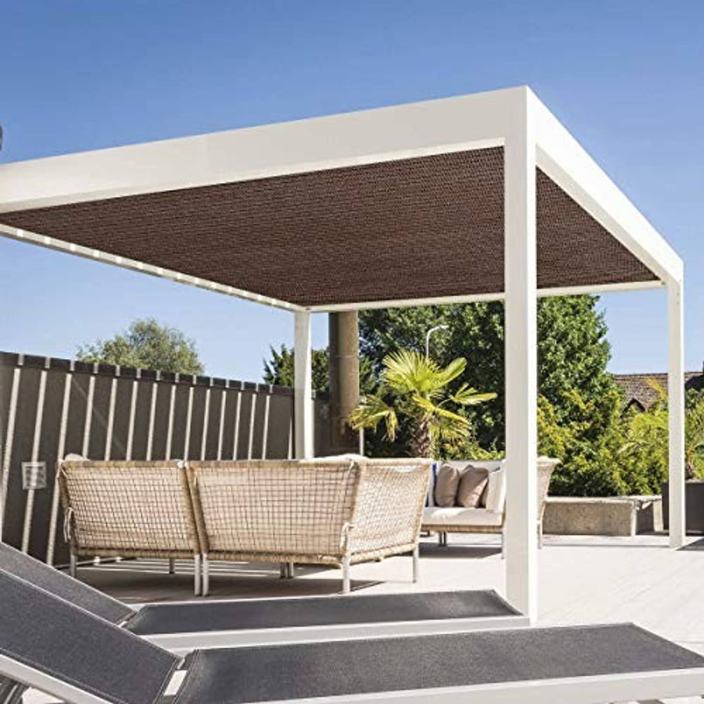 Brown rectangular shade sail stretched across an outdoor pergola for patio shade