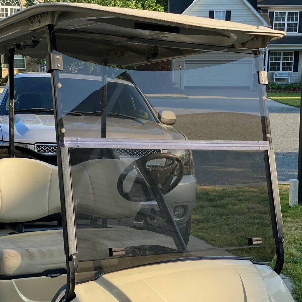 Tinted folding golf cart windshield with clear panel and black metal frame installed