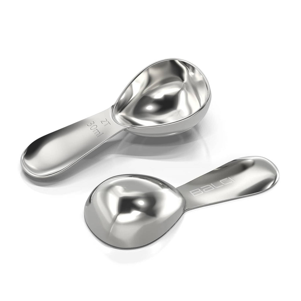 Two polished stainless steel coffee scoops with measurement markings