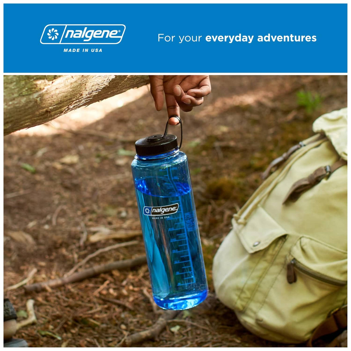 Translucent blue wide-mouth water bottle with screw lid and carry loop in hand
