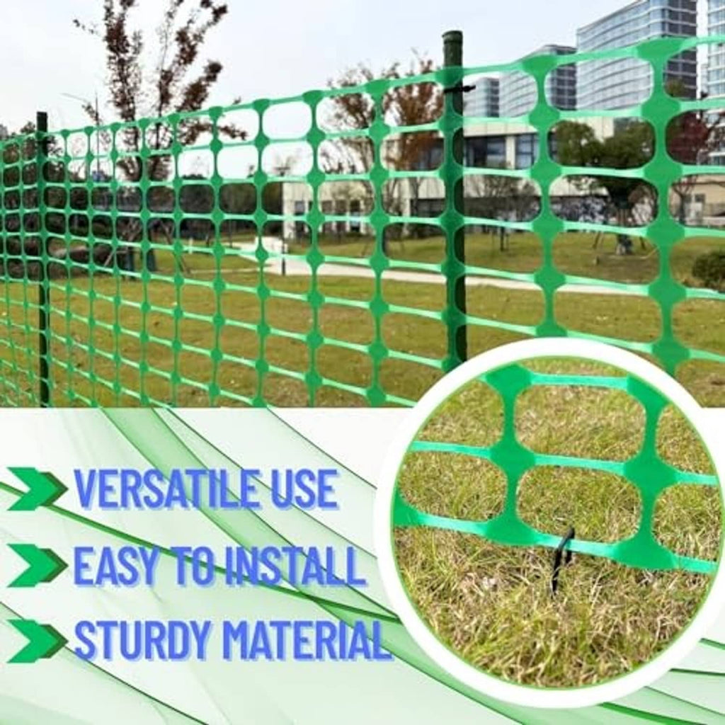 Green plastic fence with grid openings, stretched between upright stakes for yard coverage.