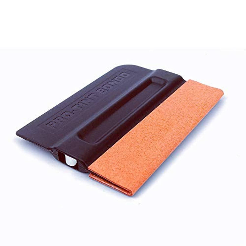 Black magnet squeegee tool with orange felt edge pad, angled view