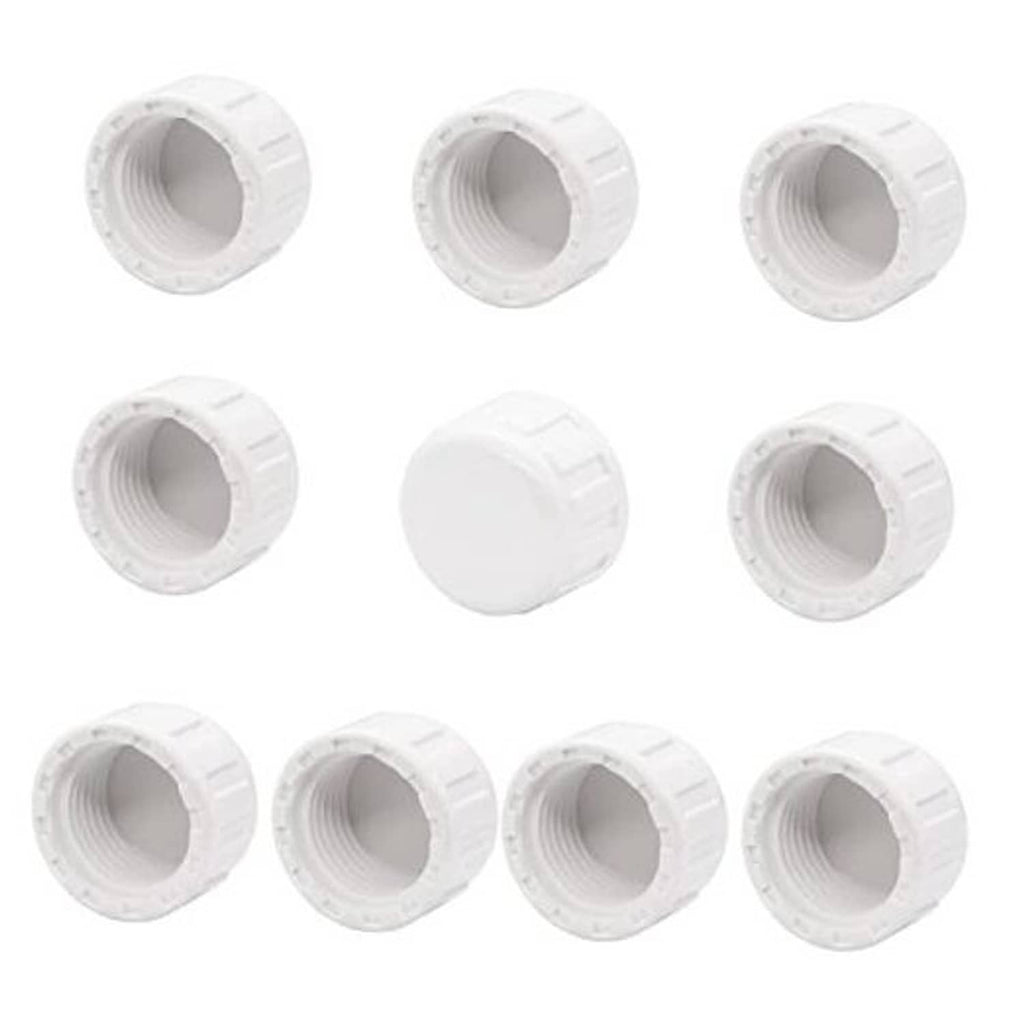 Set of white PVC female thread pipe plug adapters, multiple ridged caps